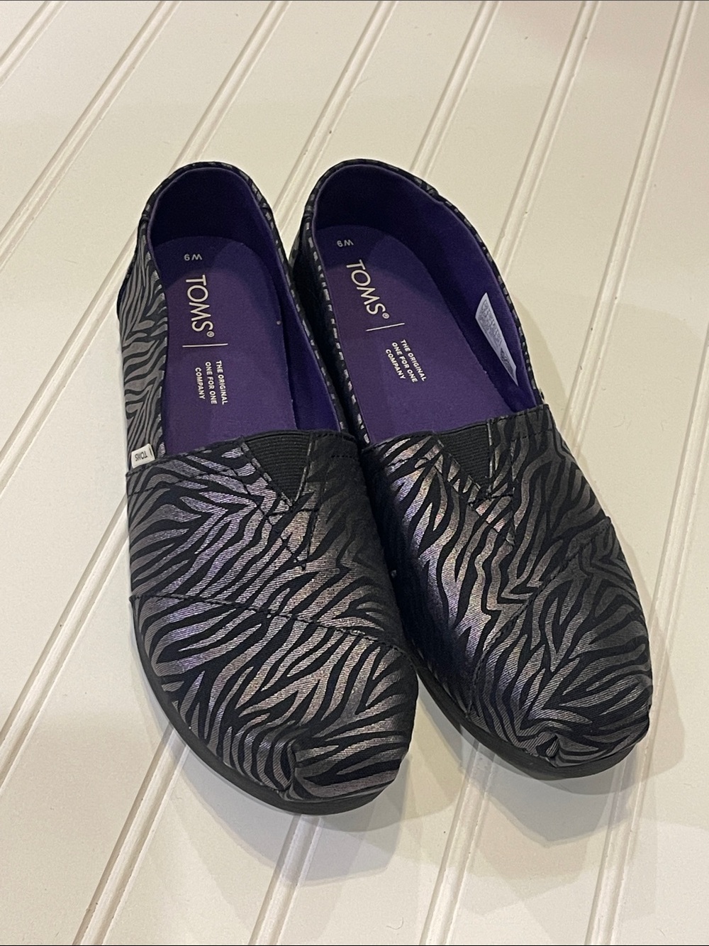 Toms Black Metallic Zebra-Print Canvas Slip-Ons